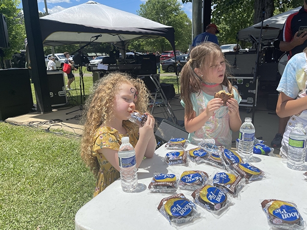 Serious Moon Pie Eating Contestants at Leeds Creek Bank Festival